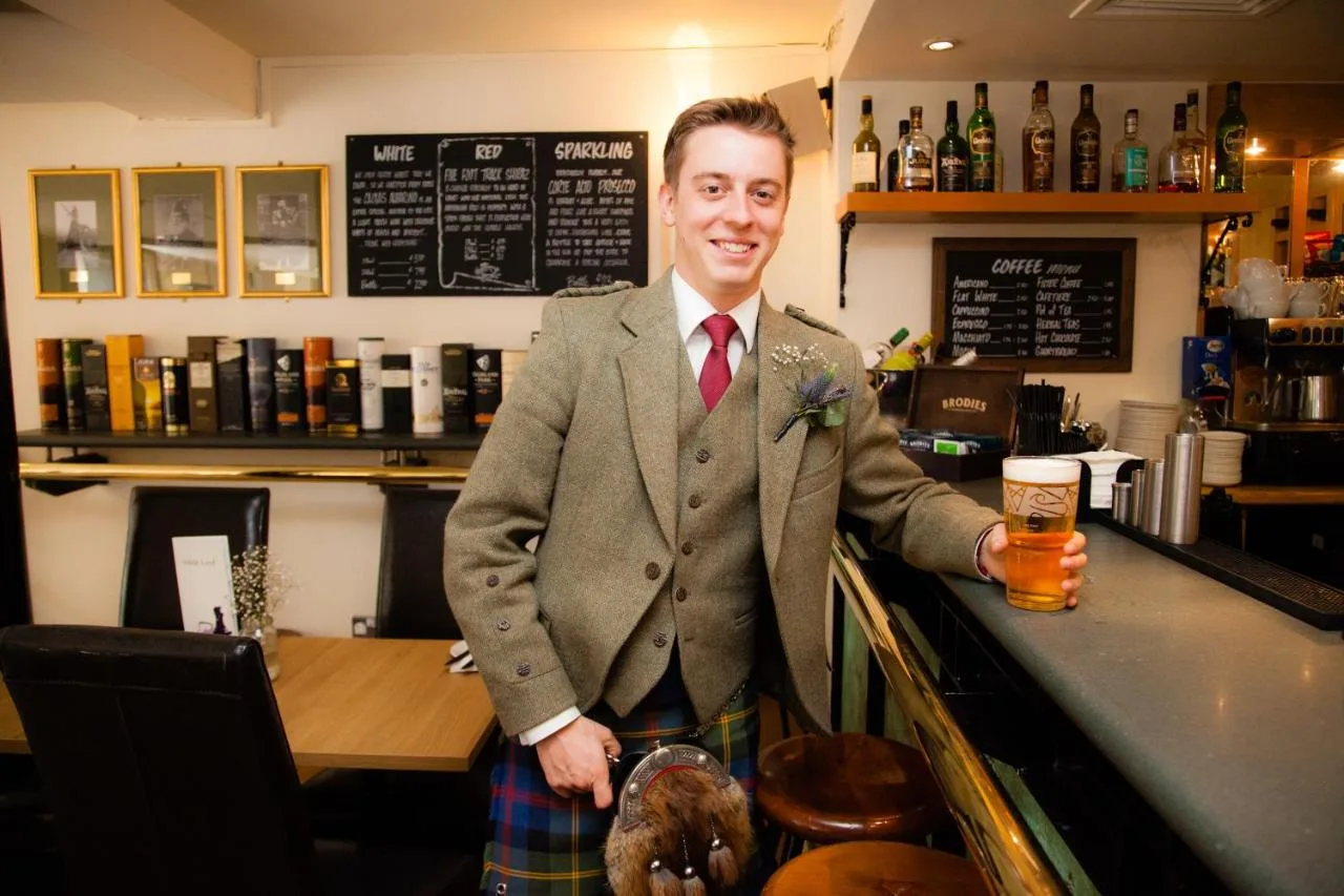 Bar with a barman in tweed